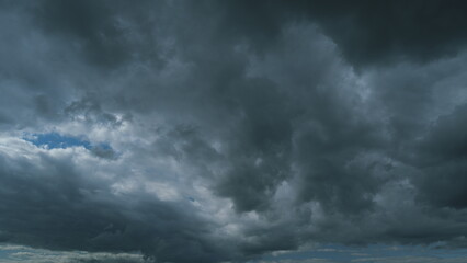 Storm Cloudy Cloudscape. Rainy Dark Blue Cumulus Clouds. Cloud Changing Shape On Gray Cloudy Sky.