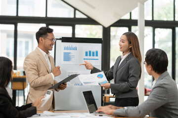 Asian Business Group Chat about graph work Present in meetings, in the office