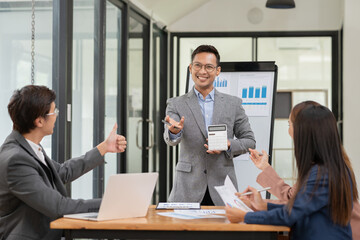 Pregnant woman sitting and playing with a tablet