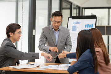 Group of business people meeting and present work on the board