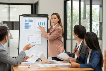 Pregnant woman sitting and playing with a tablet