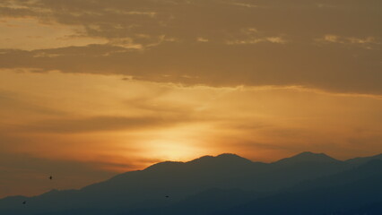 Natural Outdoor Travel Background. Sunrise In The Mountains. Foggy Slopes And Valleys. Real time.