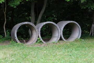 Three concrete cylinders placed horizontally