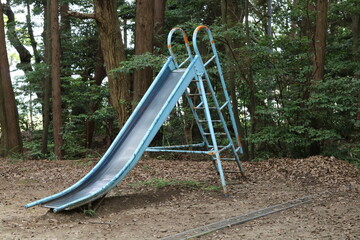 Blue slide with bald paint in places