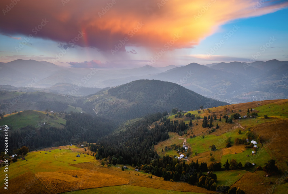 Sticker Fantastic rustic scene with green rolling hills from a bird's eye view. Carpathian mountains, Ukraine.