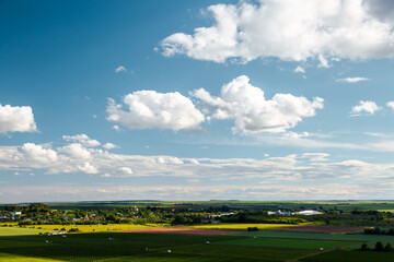 Fototapeta premium A fantastic cumulus clouds over the horizon on a sunny summer day.