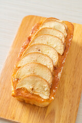 apple loaf crumbled on wood board