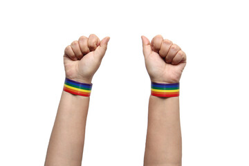 Two hands of 2 people wearing rainbow bracelets on their wrists with the colors of the gay flag, a symbol that represents the LGBTQIA+ community