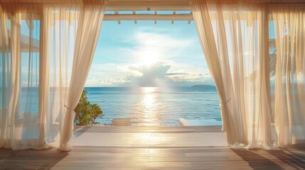 A beachfront villa with white curtains billowing in the sea breeze offering a serene view of the ocean.
