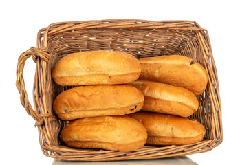 Several fragrant sweet rolls in a basket, macro, isolated on a white background.