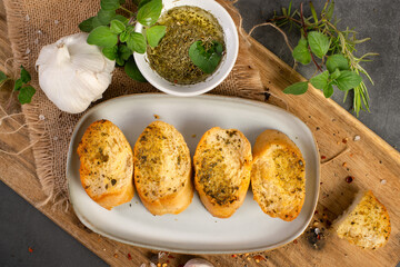 Tasty baguette with garlic and herbs 