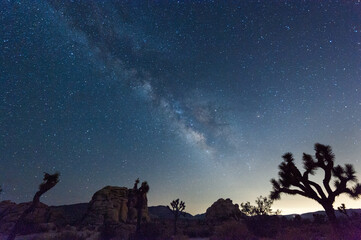 Impression of the night sky on a quiet summer evening in Joshua Tree national park, showing the milky way and many stars.