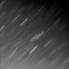 星が降り注ぐモノクロの夜空