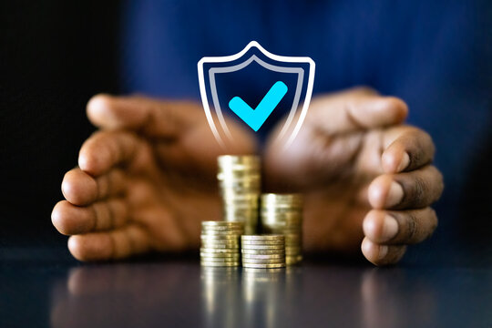 African American businessman counting coins to protect income and invest