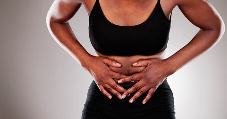 African American woman suffering from abdominal liver pain and cramp