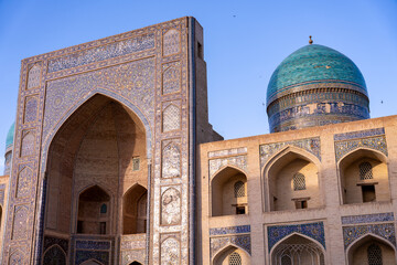 The building has a blue dome and is decorated with blue tiles. The building is old and has a lot of detail