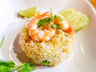 Close up of fried rice with shrimp in a white plate , Thai street food concept