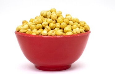 Roasted Garbanzo Bean or Chickpea in a Red Bowl Isolated on White Background with Copy Space, Also Known as Bengal Gram or Egyptian Pea