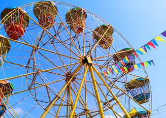Summer Background ferris wheel on a blue sky