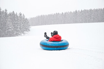 Snow tubing on a snowy day