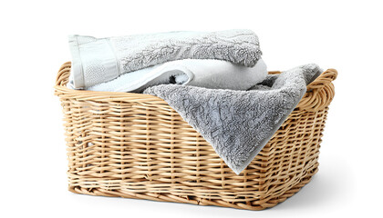 Obraz premium Wicker laundry basket with clean towels isolated on white