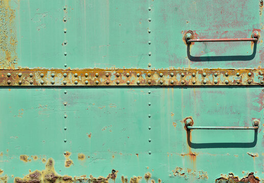 Green siding of train boxcar