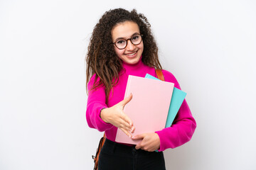 Young student Arab woman isolated on white background shaking hands for closing a good deal