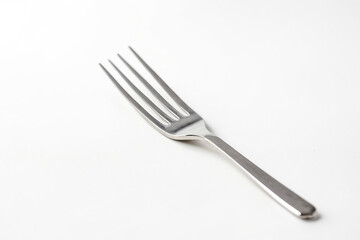 Silver fork on white background