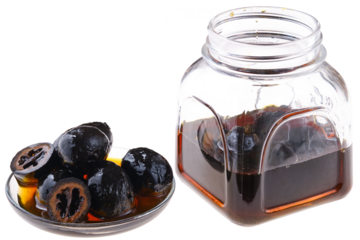 Homemade preserved walnuts isolated on white