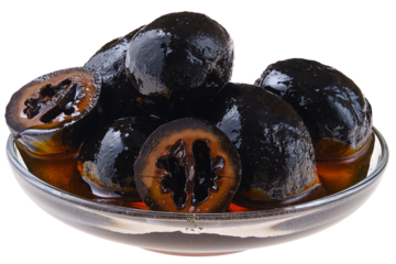 Saucer with homemade preserved walnuts isolated on white