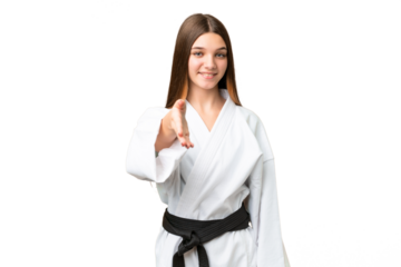 Teenager girl doing karate over isolated chroma key background shaking hands for closing a good deal