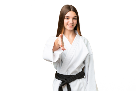 Teenager girl doing karate over isolated chroma key background shaking hands for closing a good deal