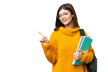 Young student woman over isolated chroma key background pointing to the side to present a product