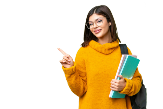 Young student woman over isolated chroma key background pointing to the side to present a product