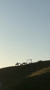 Mountains and rider on the horses in Kazakhstan