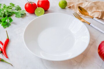 Empty ceramic white plate with spoon and fork  on white background table and ingredient