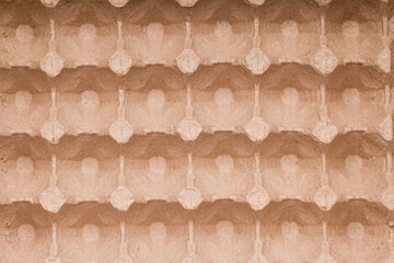  Biodegradable paper packaging with repeating pattern for fragile hen eggs. Empty biodegradable molded egg box made of paper pulp , close up view . Top view