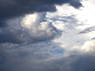 Cumulus clouds. White clouds on the blue sky close-up.