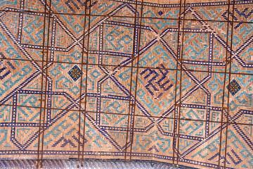 A wall with a pattern of squares and triangles