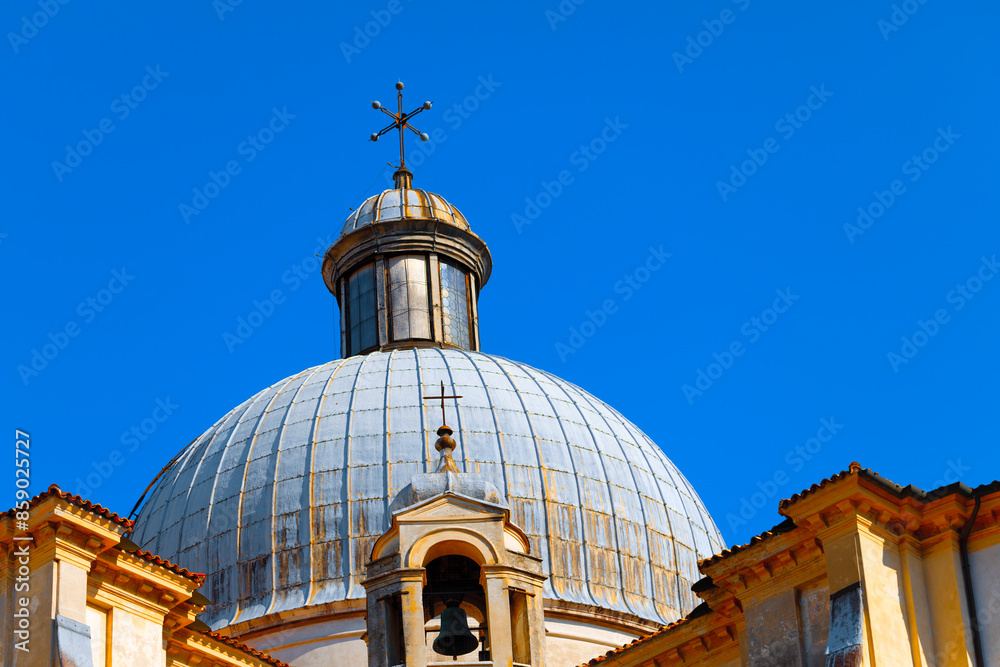 Wall mural Large dome with a cross on top. Majestic building with a grand dome and belfry atop. Architectural elegance and timeless charm of Venice