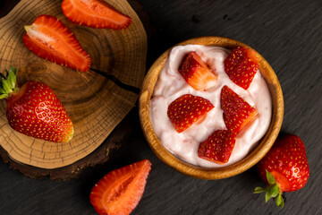 yogurt made from milk with added flavor and pieces of ripe strawberries