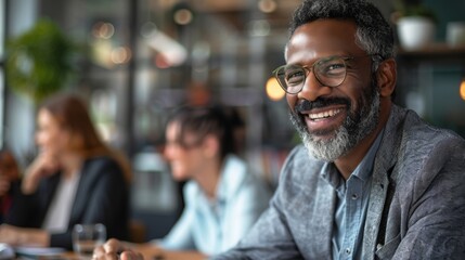 Fototapeta premium portrait of african american business confident mature man sitting at table in office meeting, executive portrait in office
