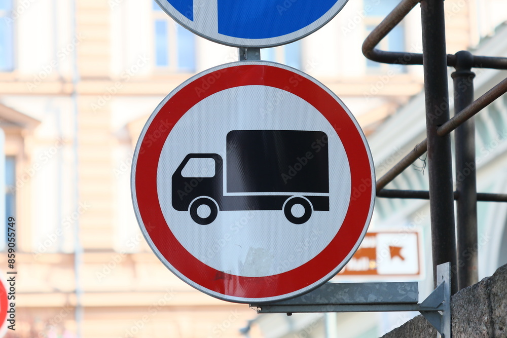 Poster red and white sign with warning symbol and blue and white sign with another warning symbol for road 