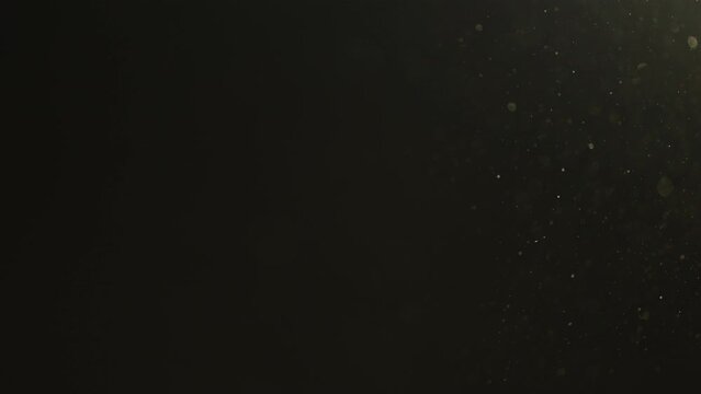 Slow motion real dust particles floating in the air indoor with natural sun light