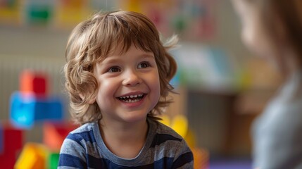 Caucasian preschool boy at a consultation or lesson with a speech therapist or child psychologist