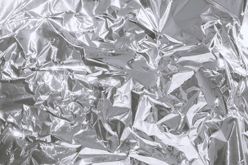 Shiny metal silver gray foil crumpled texture background