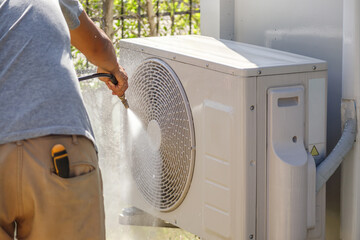air conditioning compressor outdoor unit cleaning service with water spray