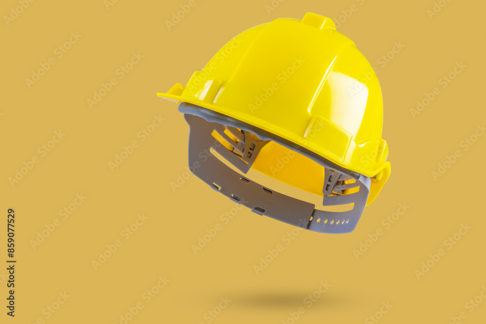 Wall mural safety construction helmet on yellow background