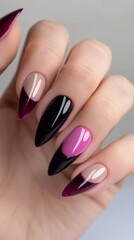 Elegant Stiletto Nails with Glossy Black and Magenta Polish Design