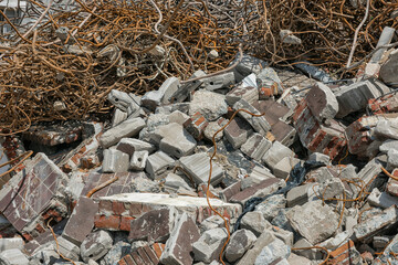 concrete, stones and twisted steel waste lie in a large heap